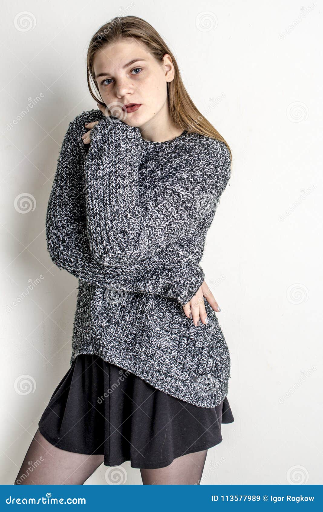 Young Beautiful Girl Wrapped in a Gray Long Warm Sweater Stock Image ...