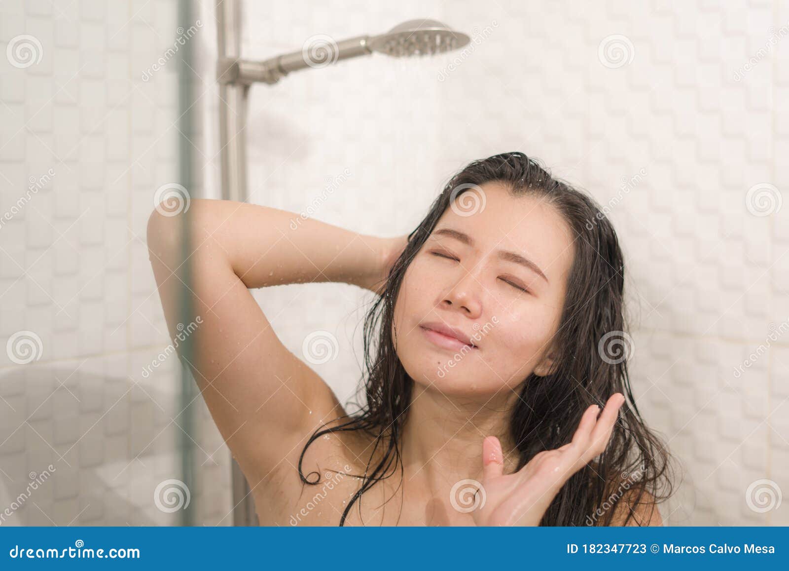Young Beautiful And Happy Asian Chinese Woman Taking A Shower In The Bathroom Washing Her Hair 