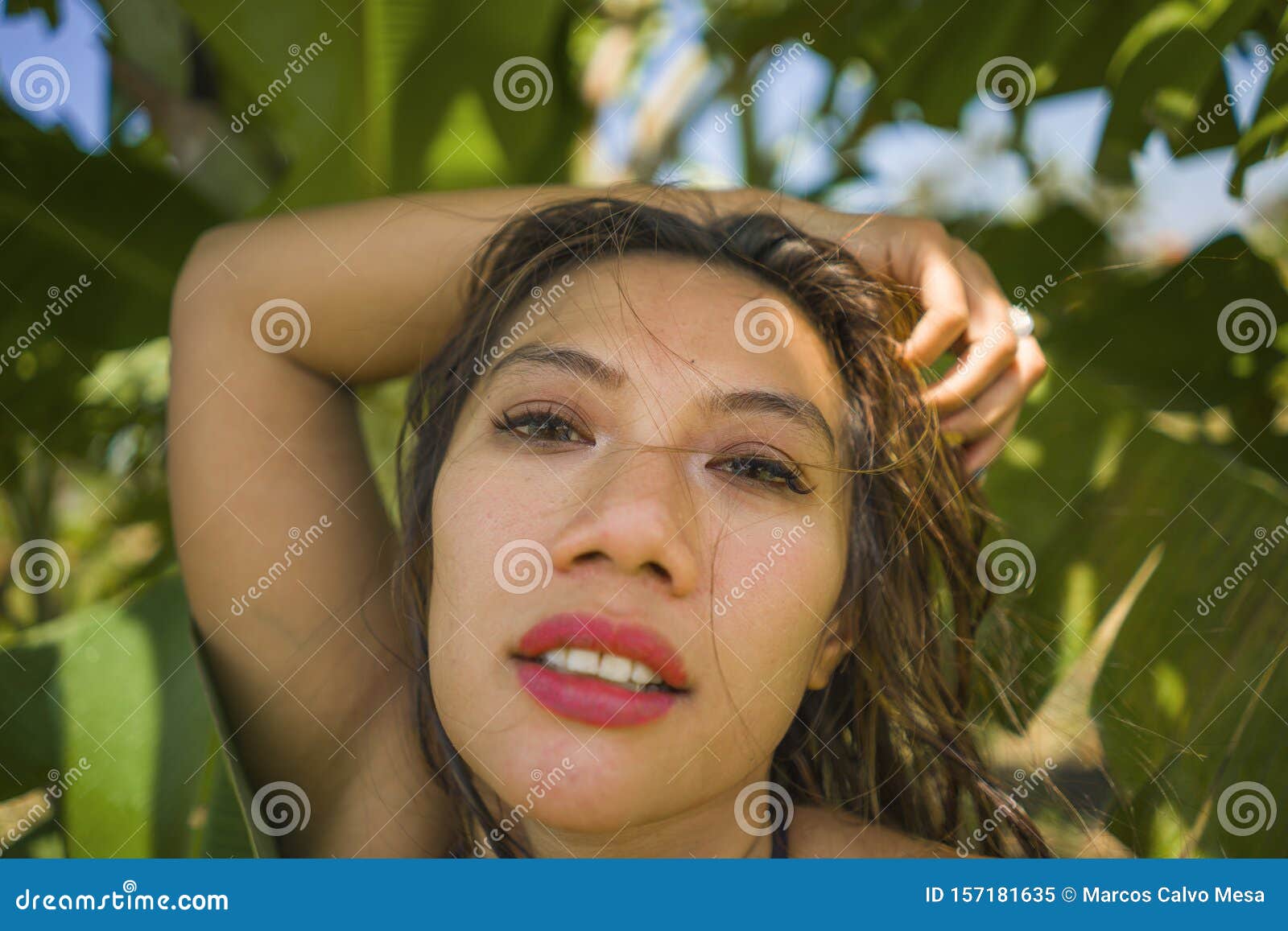 Young Beautiful And Happy Asian Indonesian Woman In Bikini Posing