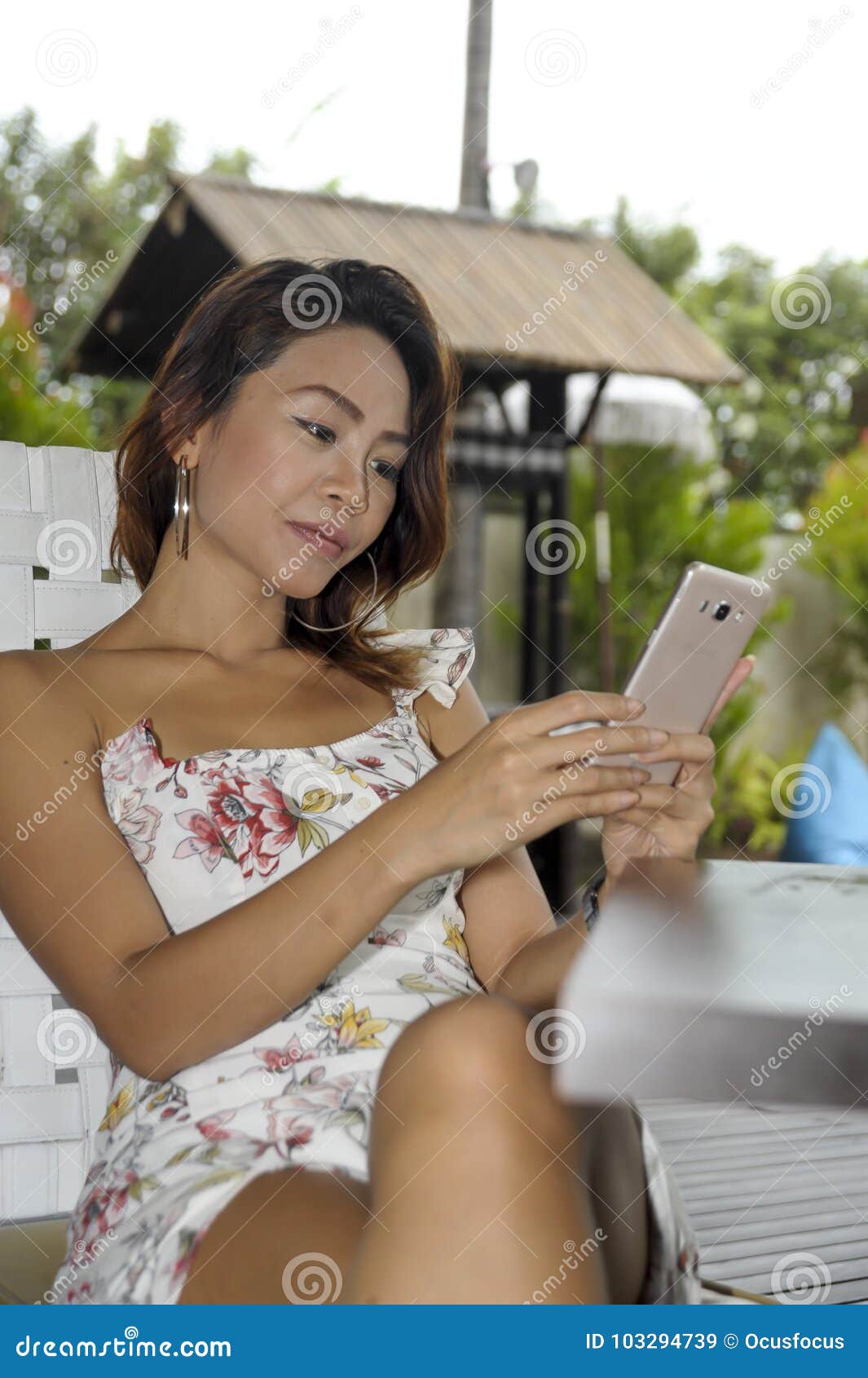 Young Beautiful and Happy Asian Woman in Dress Sitting Outd Stock Image -  Image of phone, dress: 103294739