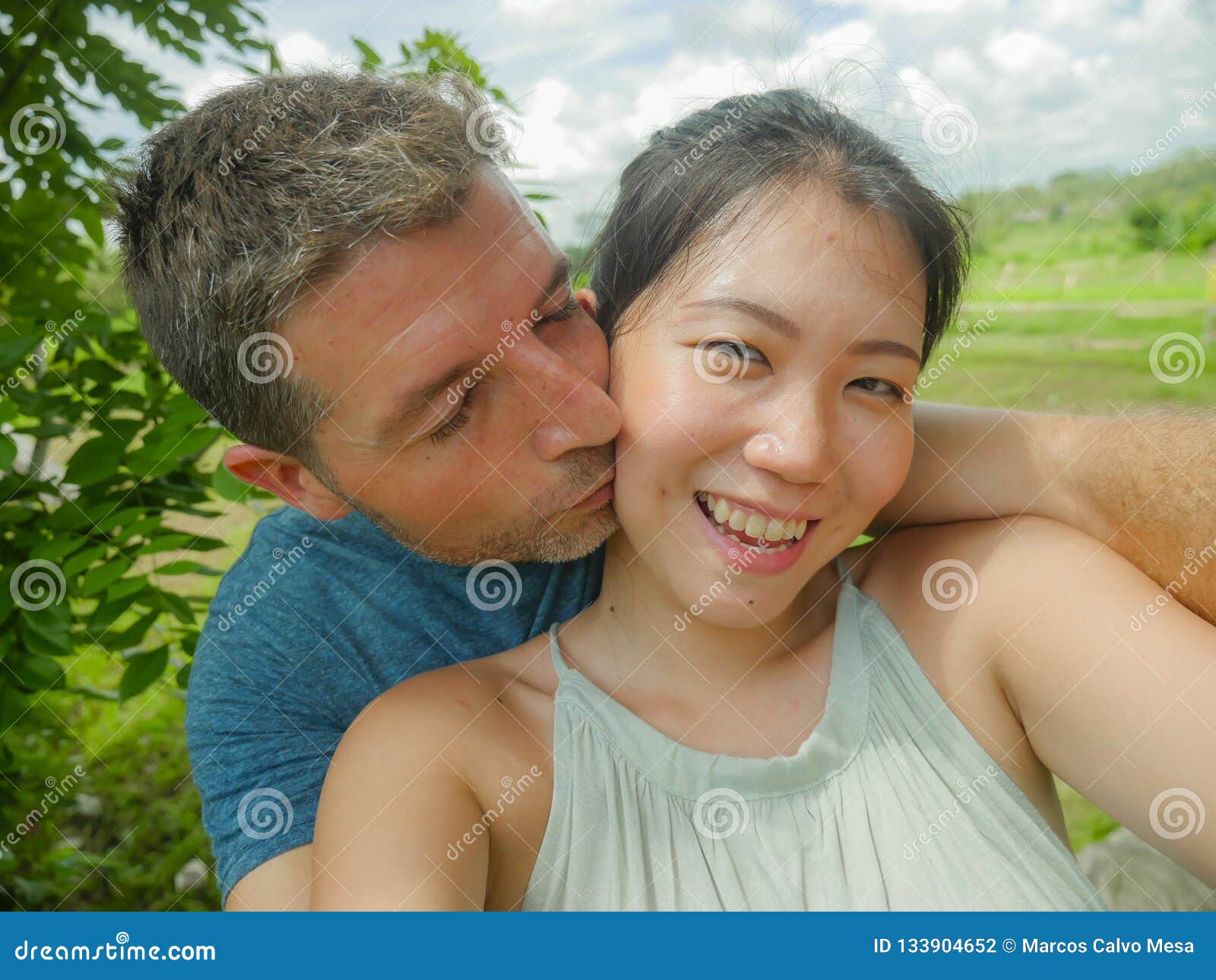 Young Beautiful and Happy Mixed Ethnicity Couple Beautiful Asian.