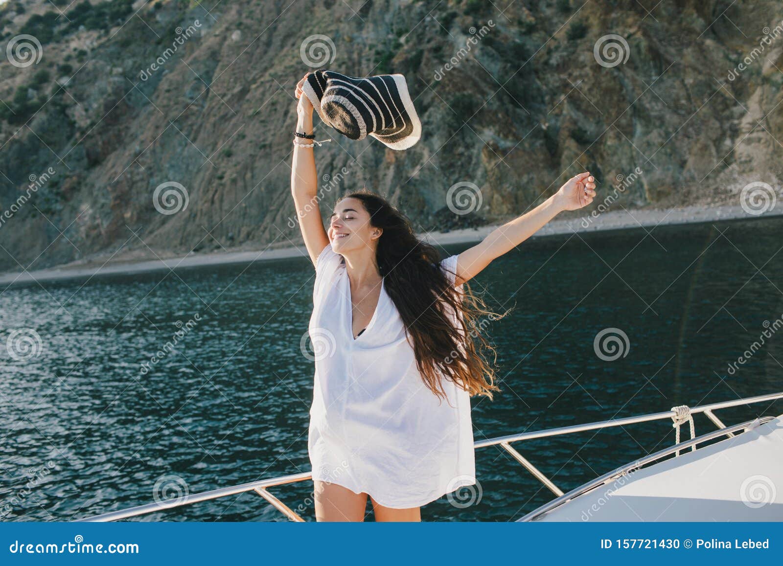 Happy Woman In Hat And Beach Clothes Posing On A Yacht ...