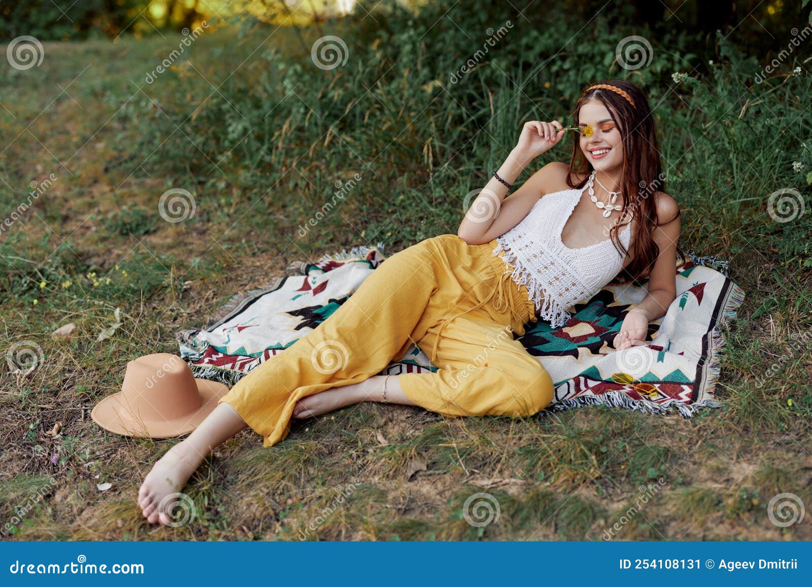 Young Beautiful Hippie Woman Lying on the Ground in Nature in the Fall ...