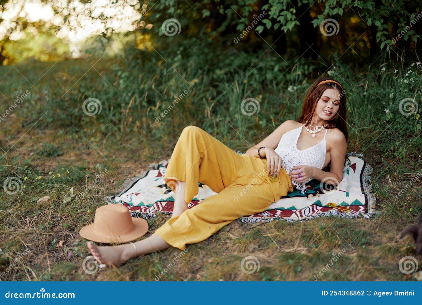 Young Beautiful Hippie Woman Lying on the Ground in Nature in the Fall ...