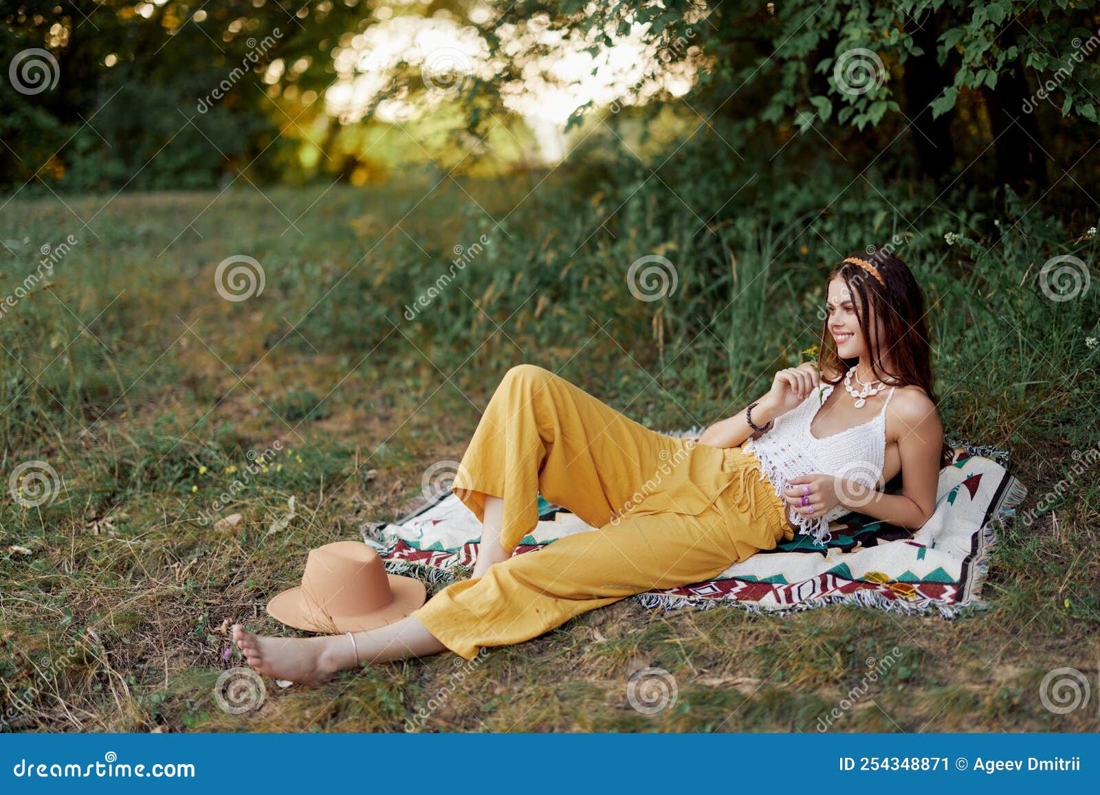 Young Beautiful Hippie Woman Lying on the Ground in Nature in the Fall ...