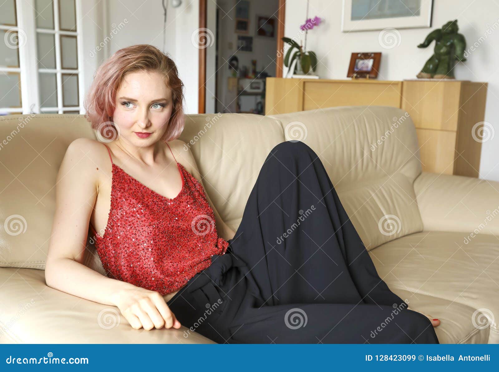 Young Beautiful Lady on the Leather Sofa Stock Image - Image of couch