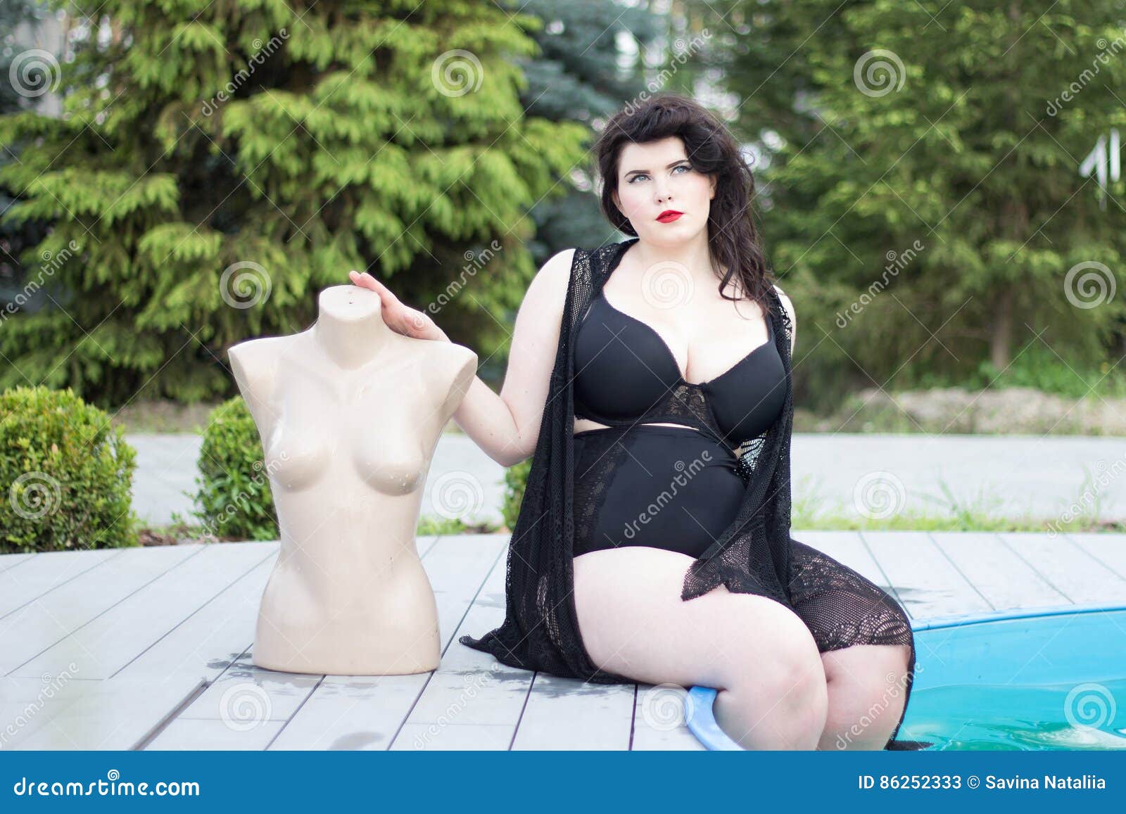 Young Beautiful Plus Size Modelt in Black Bra Holding Mannequin Stock Photo  - Image of lake, facial: 88133554