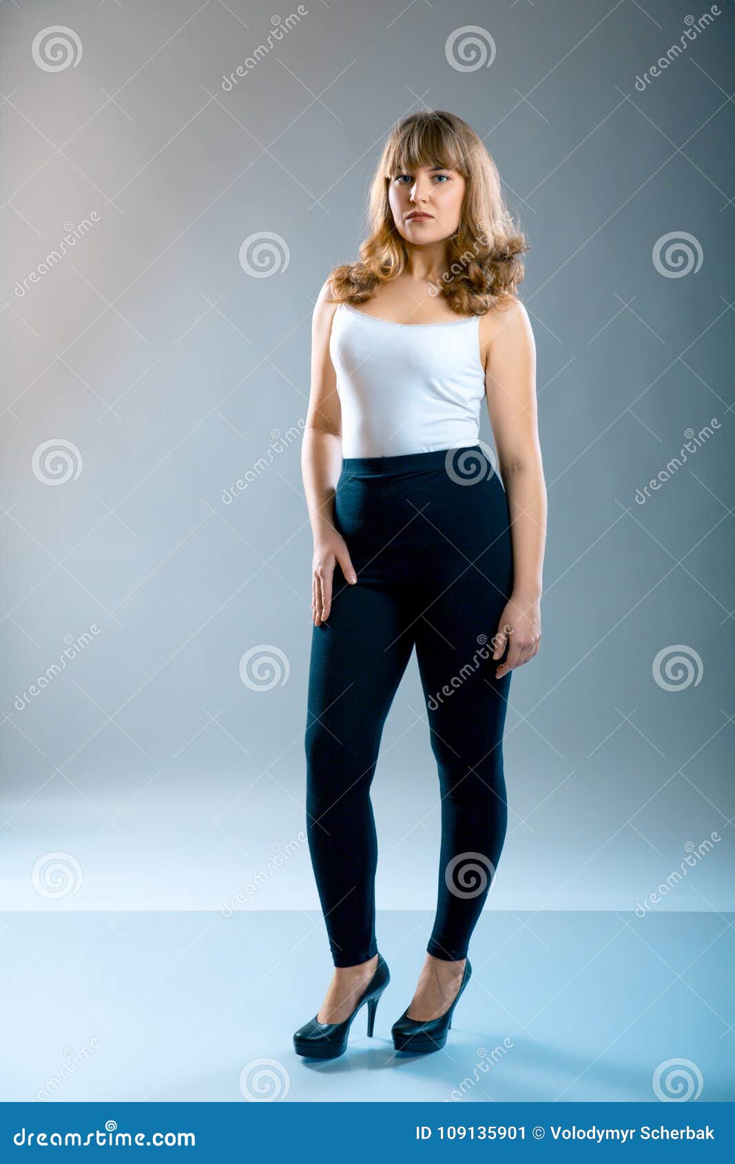 Young Beautiful Plus Size Model Wearing in Black Leggings and White Shirt,  Xl Woman on Gray Studio Background Stock Image - Image of overfat, black:  109135901