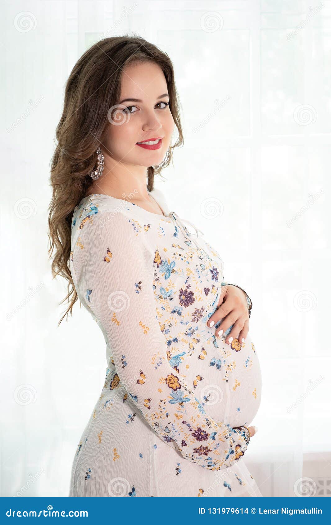 Young Beautiful Pregnant Woman Standing Near Window At Home Stock Photo Young Beautiful Pregnant Woman Standing Near Window At Home Stock Photo