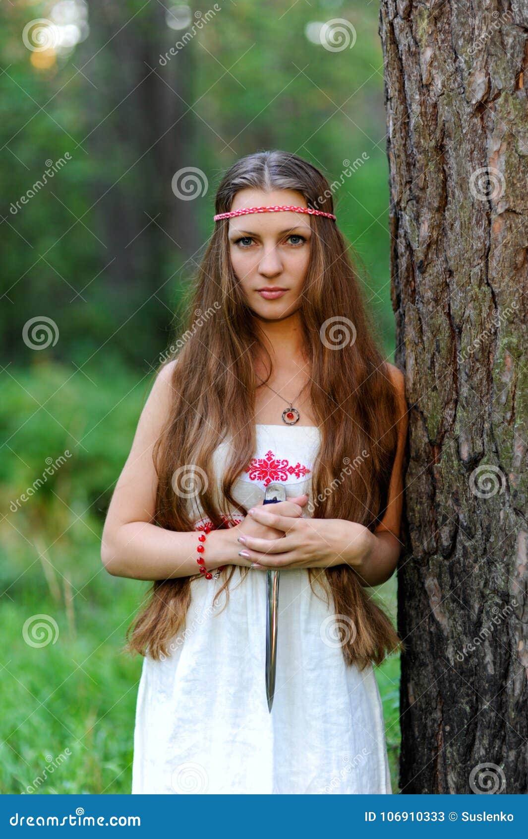 A Young Beautiful Slavic Girl with Long Hair and Slavic Ethnic Dress ...