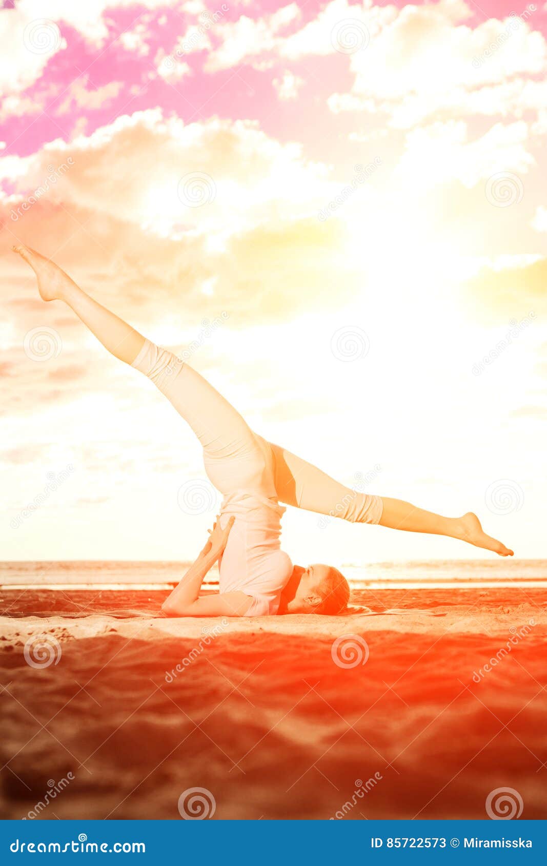 Young Beautiful Slim Woman Practices Yoga on the Beach at Sunrise. Yoga ...