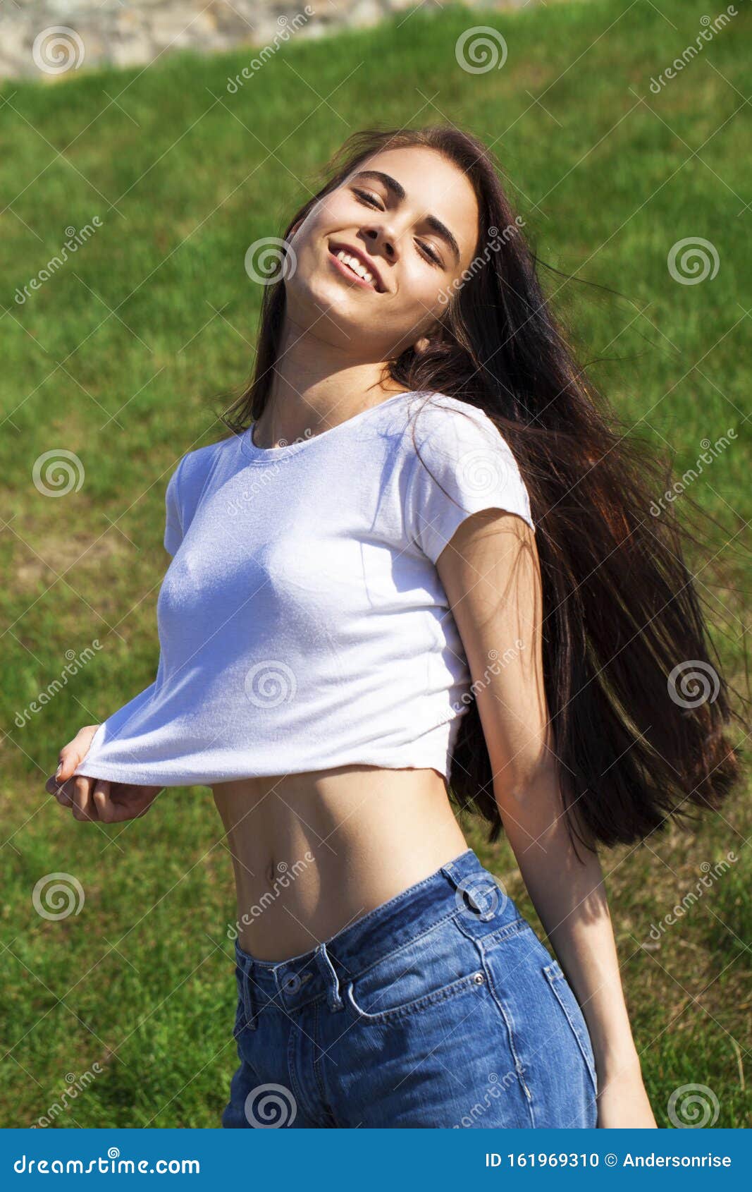 Young Beautiful Teenager Girl Posing Against Summer Park Bright Sunny