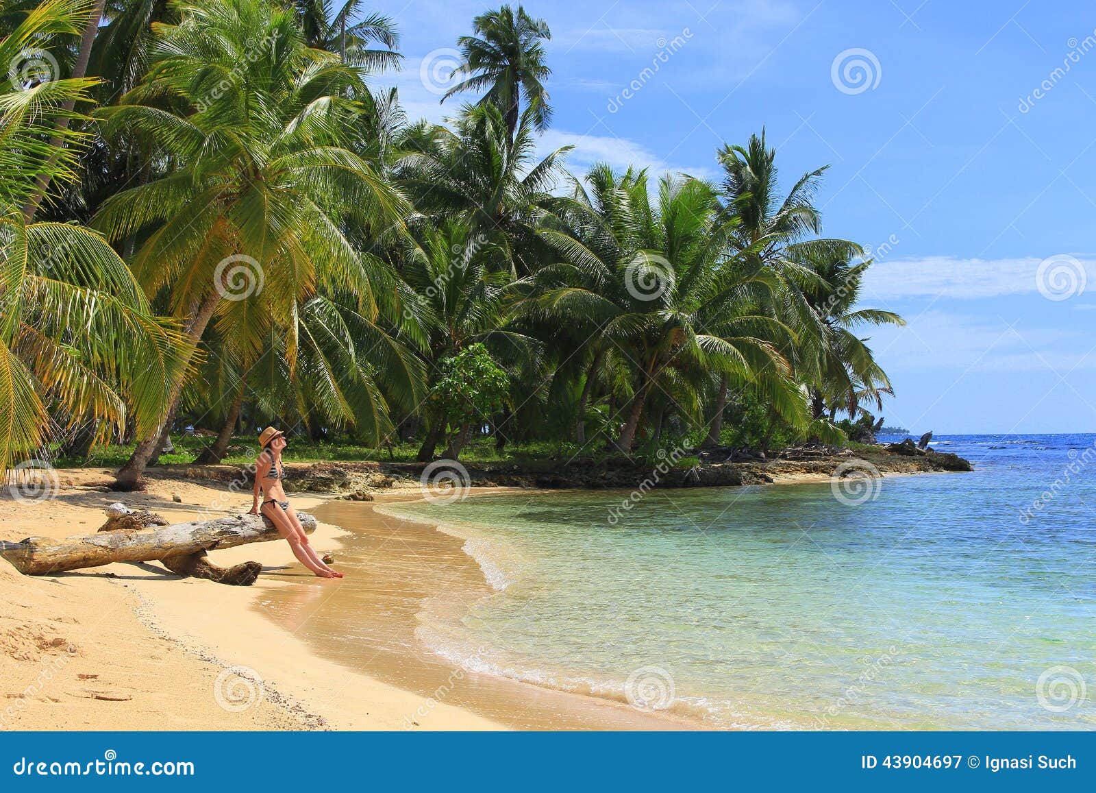 young beautiful woman enjoying her time and resting close to the sea