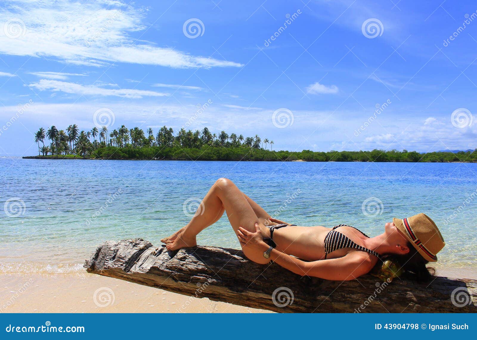 young beautiful woman enjoying her time and resting close to the sea