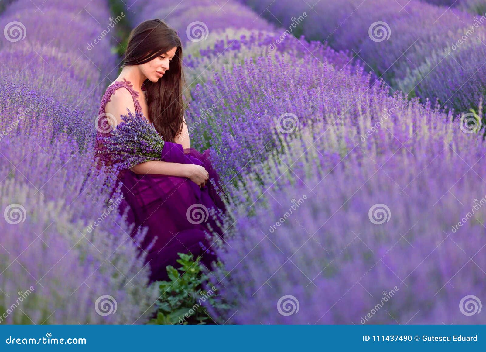 young beautiful woman in lavender fields with a romantic mood
