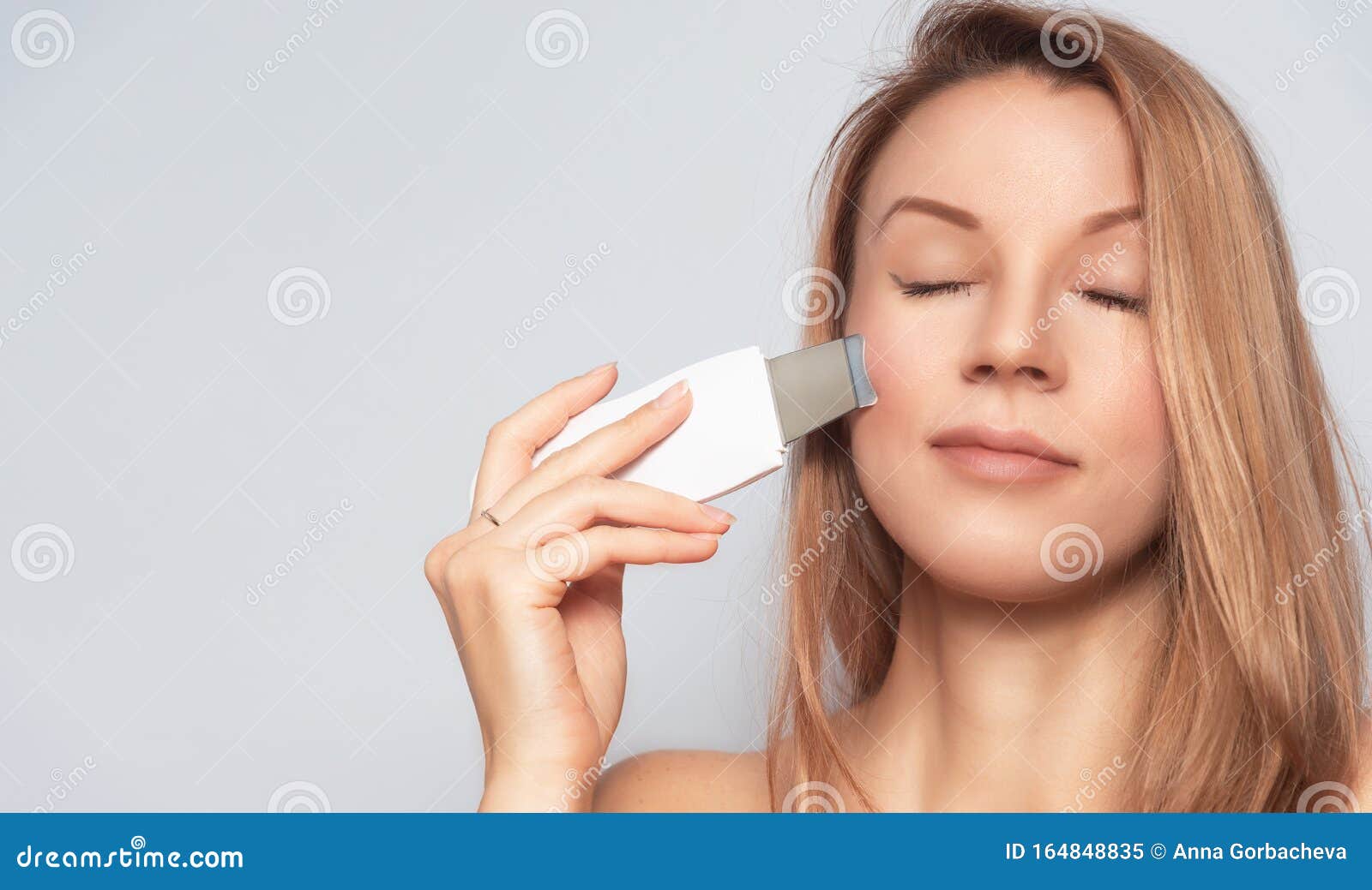 woman with skin care treatment device.