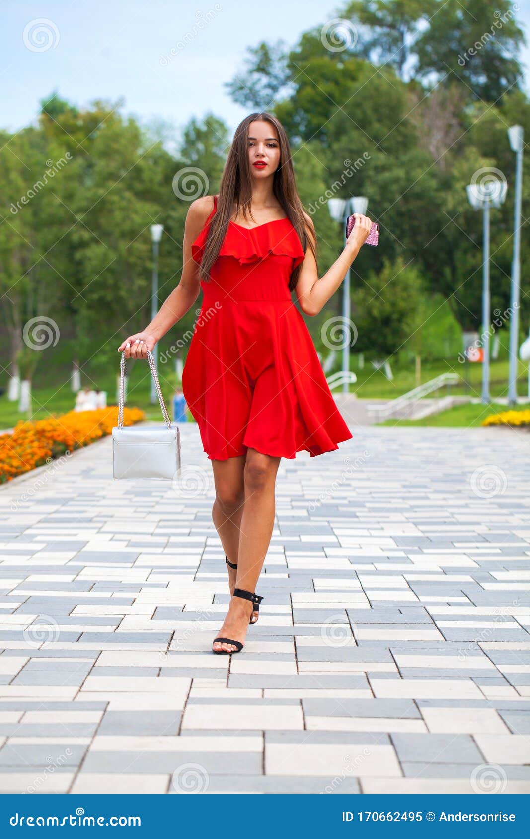 Young Beautiful Woman in Red Dress Walking on the Summer Street Stock ...