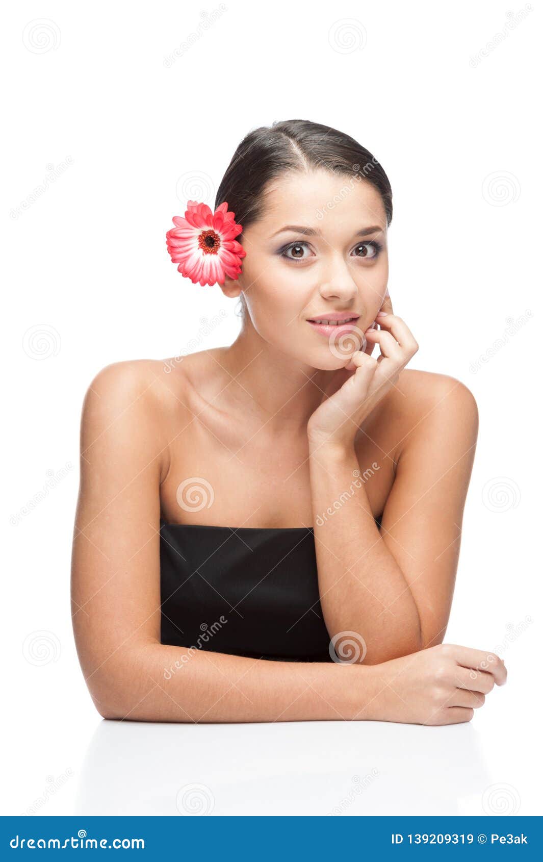 Young Beautiful Woman Relaxing With Gerbera Flower At Spa Isolated