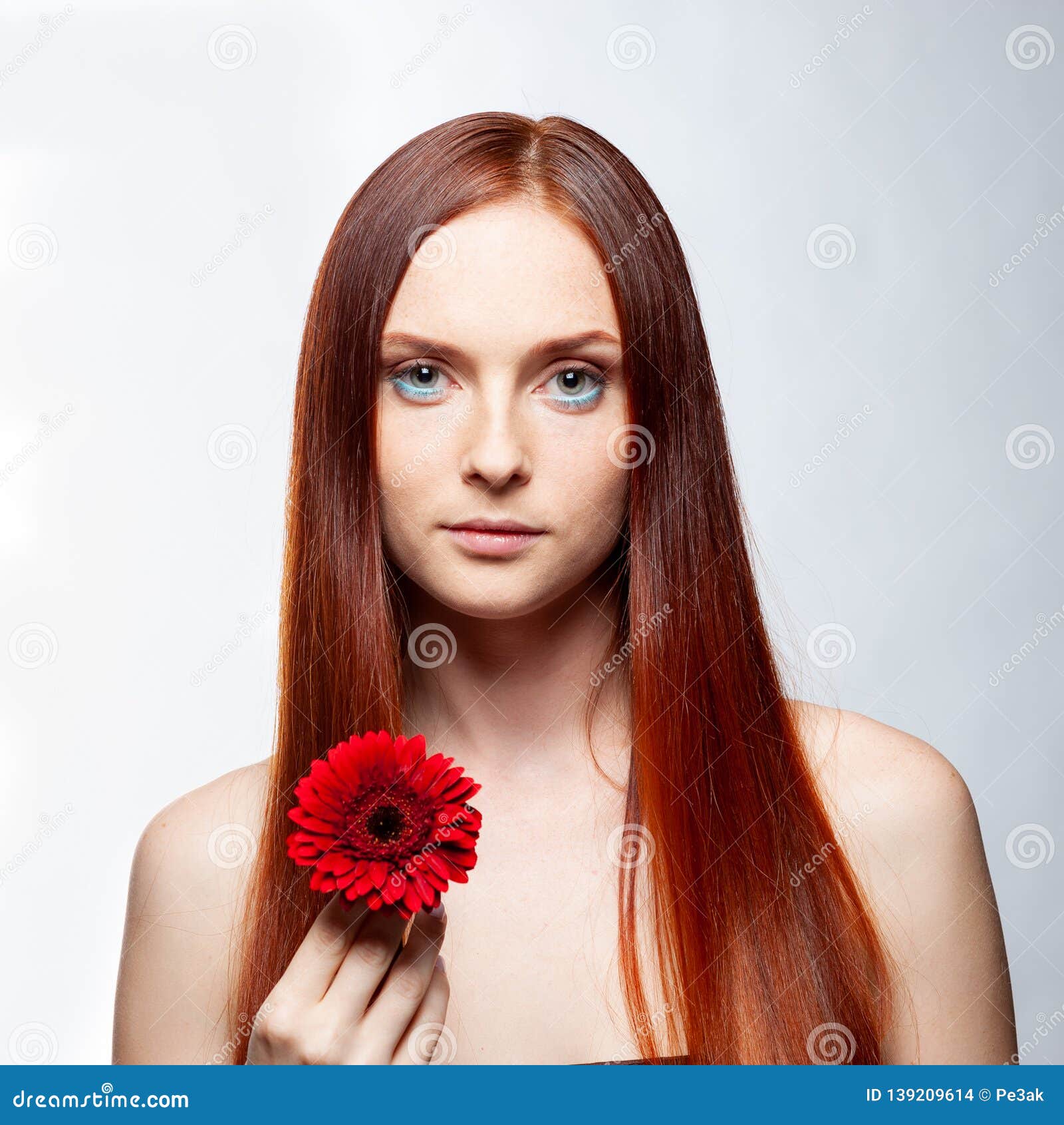 Young Beautiful Woman Relaxing With Gerbera Flower At Spa Isolated