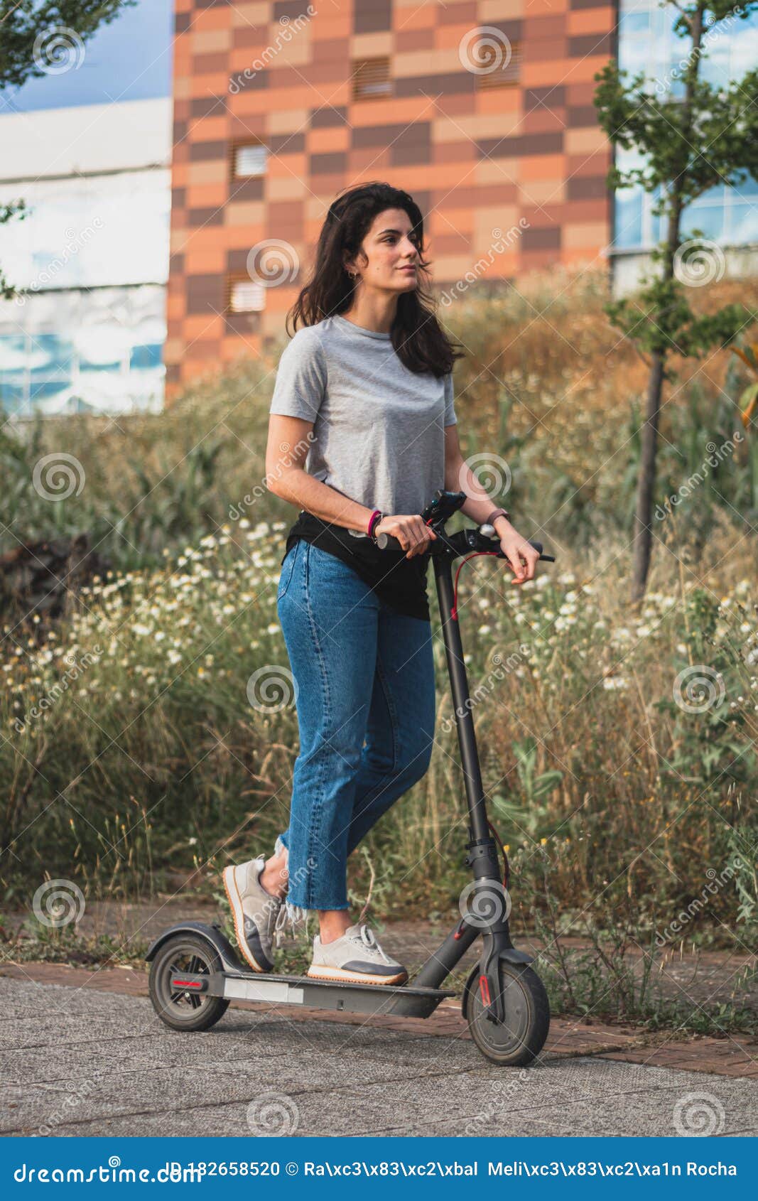 Young Beautiful Woman Riding an Electric Scooter To Work, Modern Girl ...