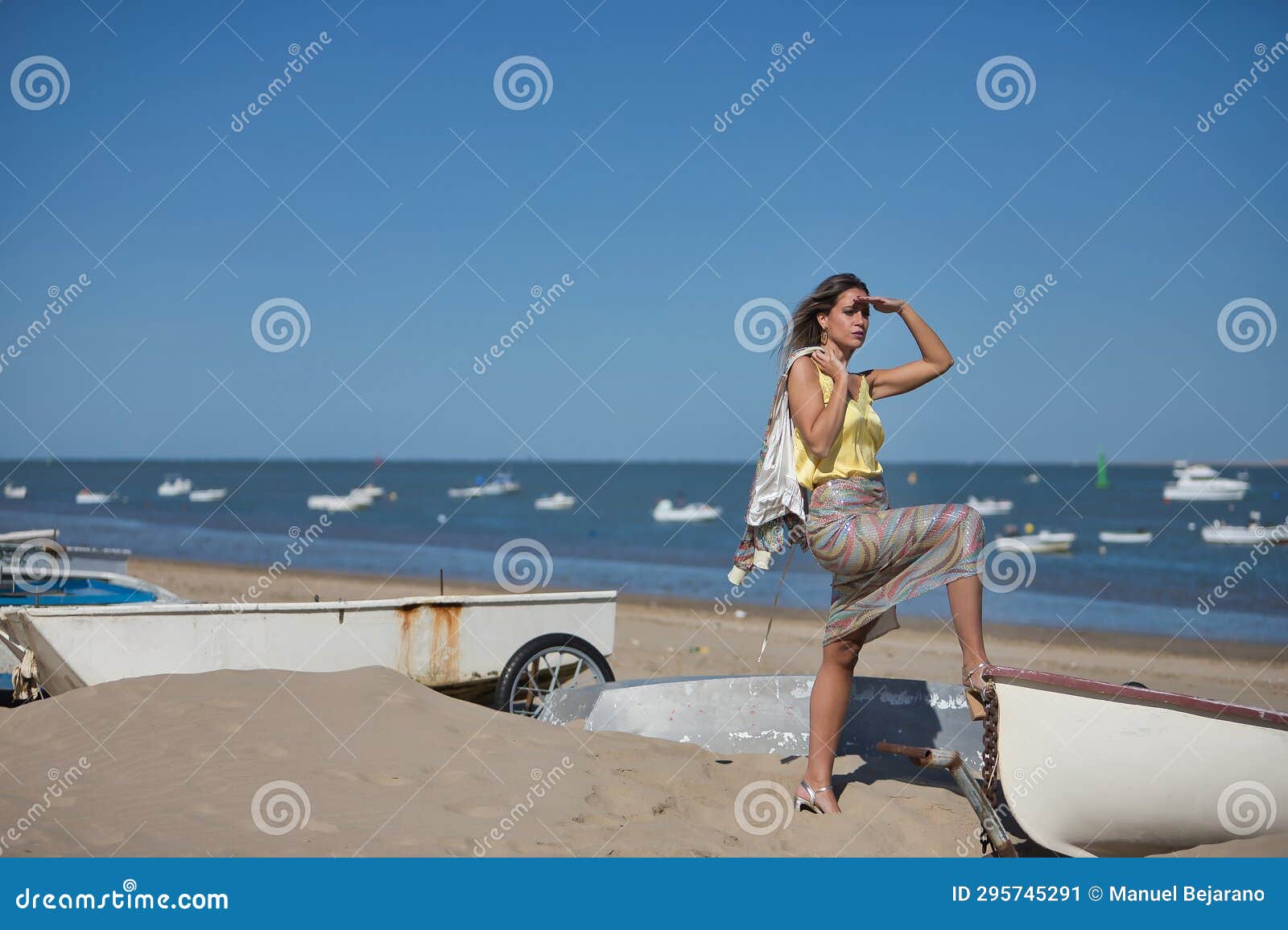 Young and Beautiful Woman in a Sequined Dress and High Heels, with Her ...