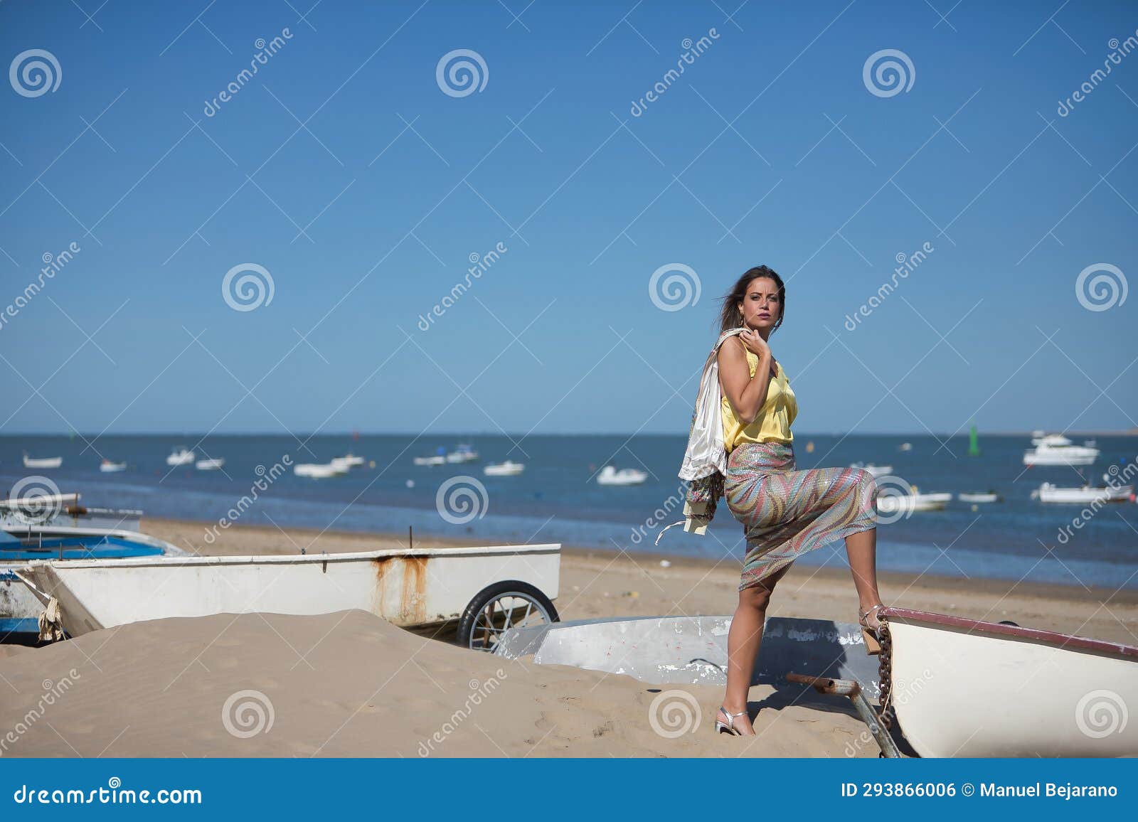 Young and Beautiful Woman in a Sequined Dress and High Heels, with Her ...