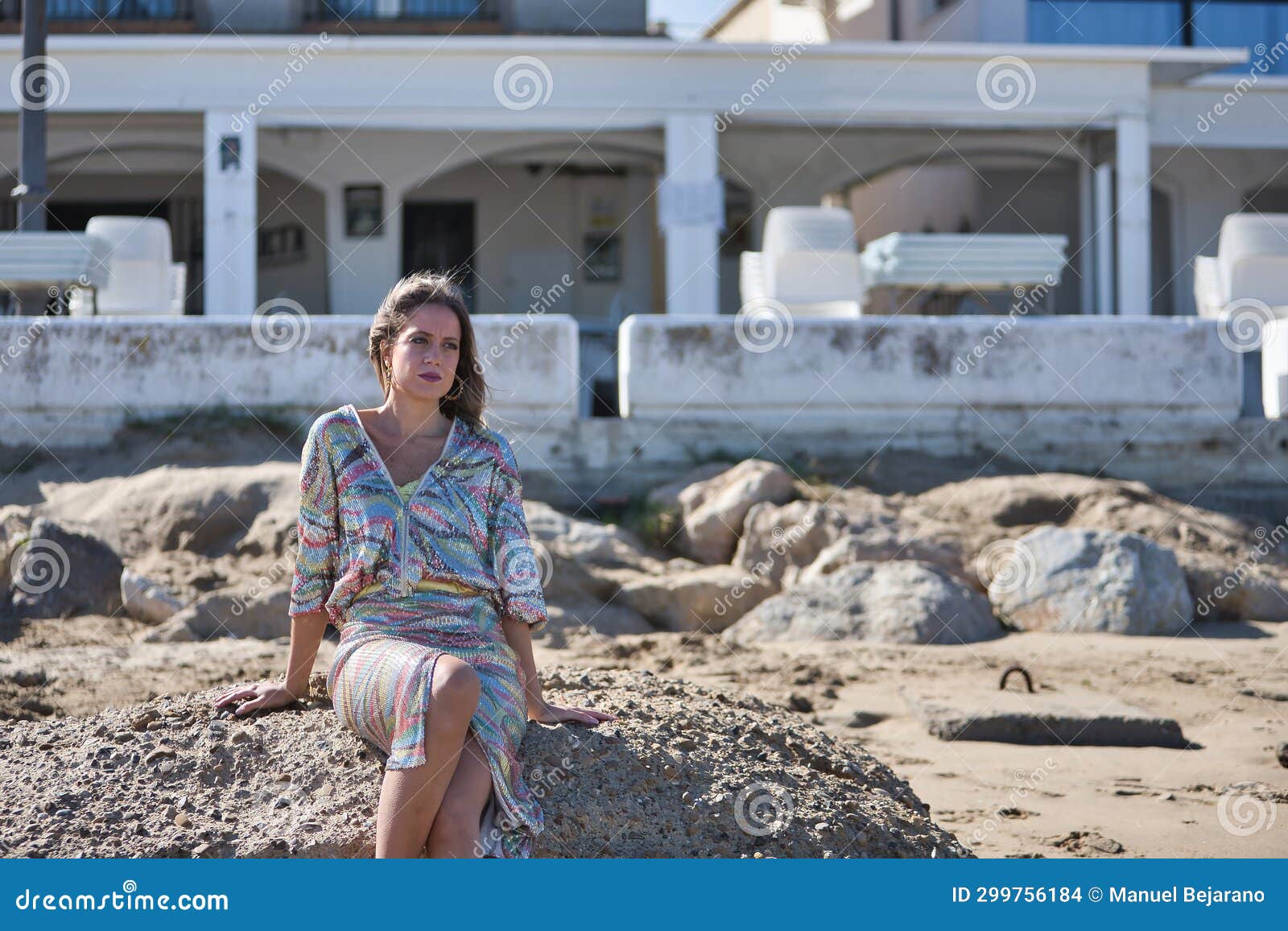 Young and Beautiful Woman in a Sequined Dress and High Heels, Sitting ...