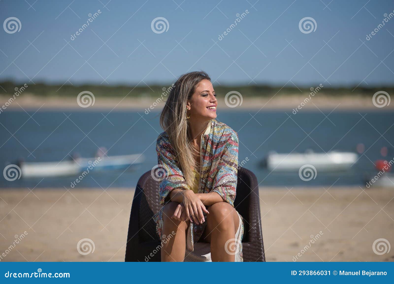 Young and Beautiful Woman in a Sequined Dress, Sitting on a Chair in ...