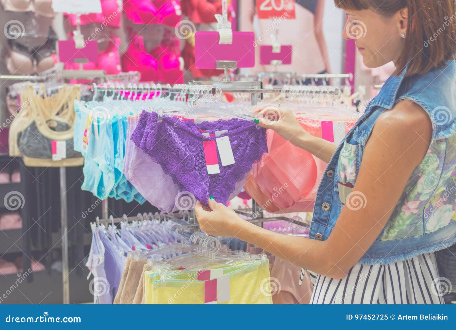 Young Beautiful Woman Shopping, Standing in the Mall, Choosing New Lilac Underwear  Panties, Looking at Fabric or Price Stock Image - Image of customer,  choose: 97452725