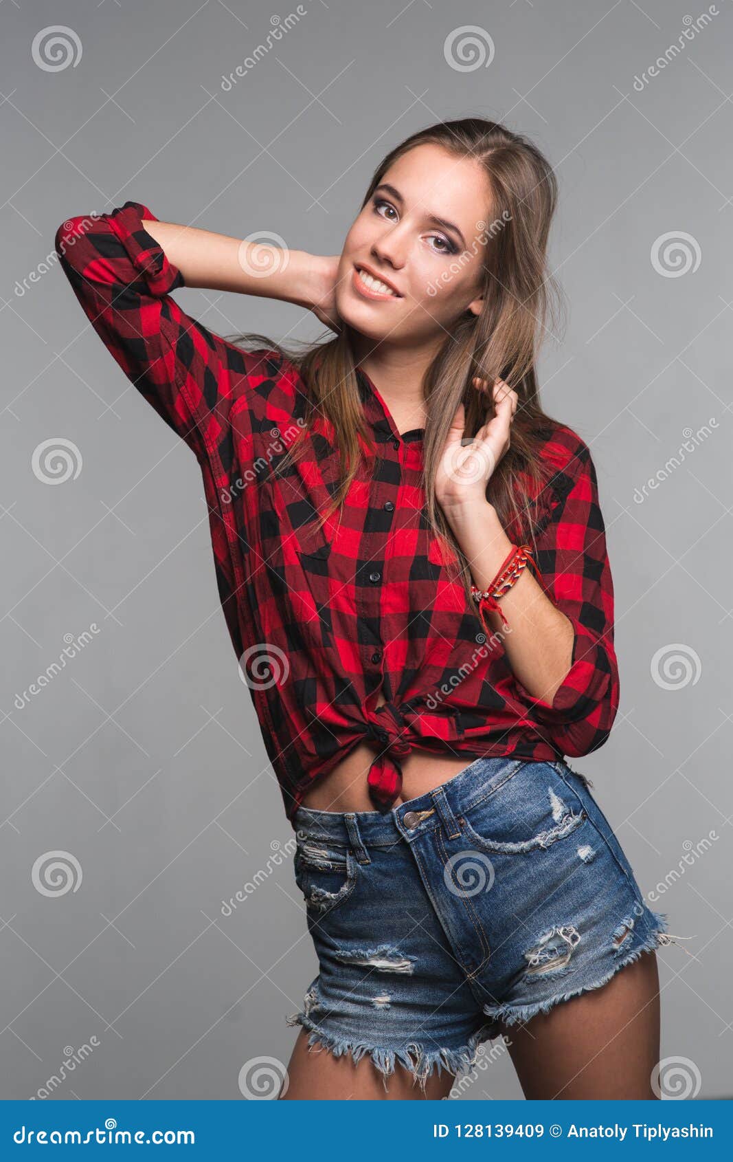 Young Beautiful Woman Teenager in a Red Checked Shirt and Torn D Stock ...