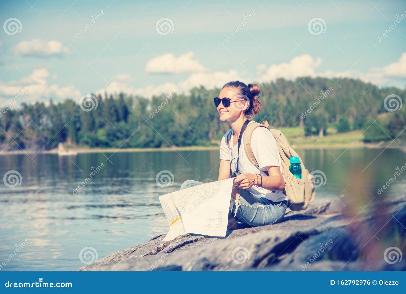 https://thumbs.dreamstime.com/z/young-beautiful-woman-traveler-map-hands-sits-lake-norway-young-beautiful-woman-traveler-map-hands-162792976.jpg