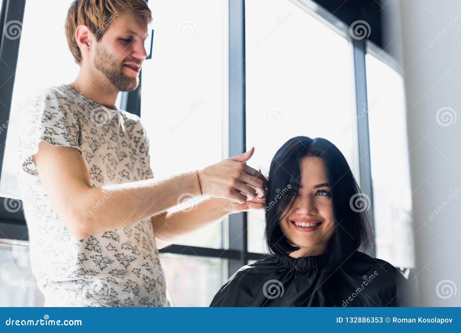 Young Beautiful Woman Having Her Hair Cut at the Hairdresser`s. Young Male  Hairdresser Smiling and Making Hairstyle To Stock Image - Image of  business, beauty: 132886353
