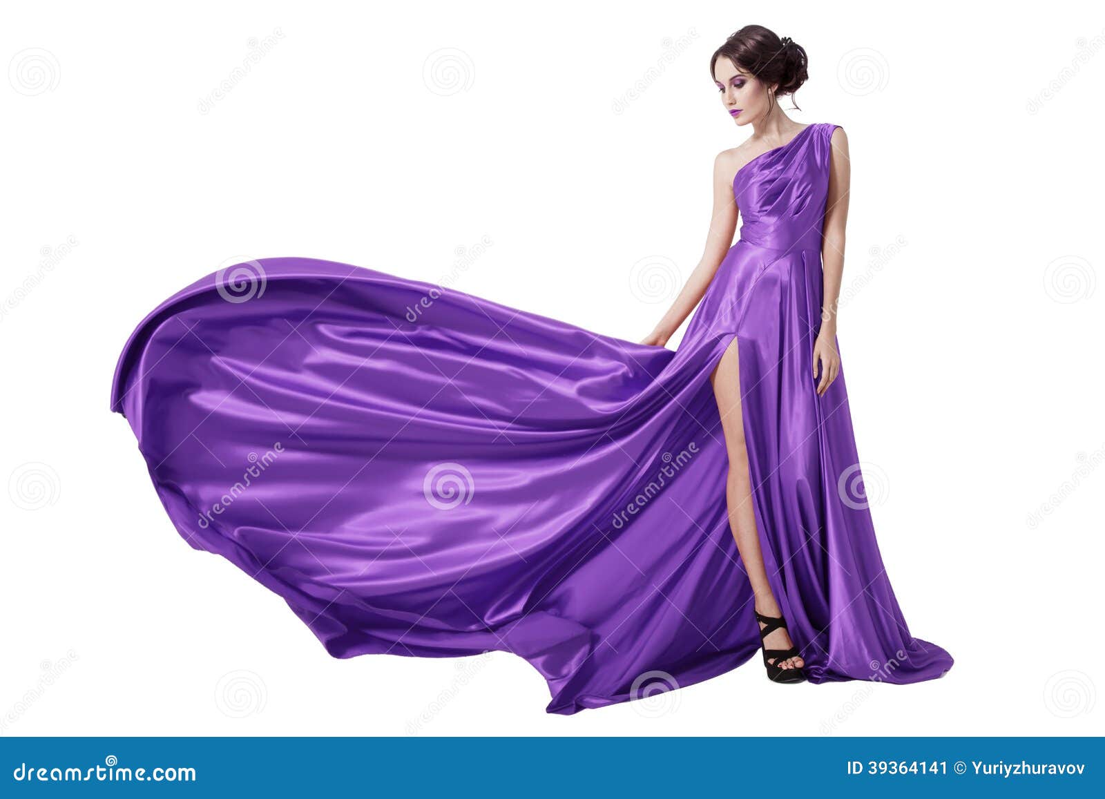 young beauty woman in fluttering violet dress. 