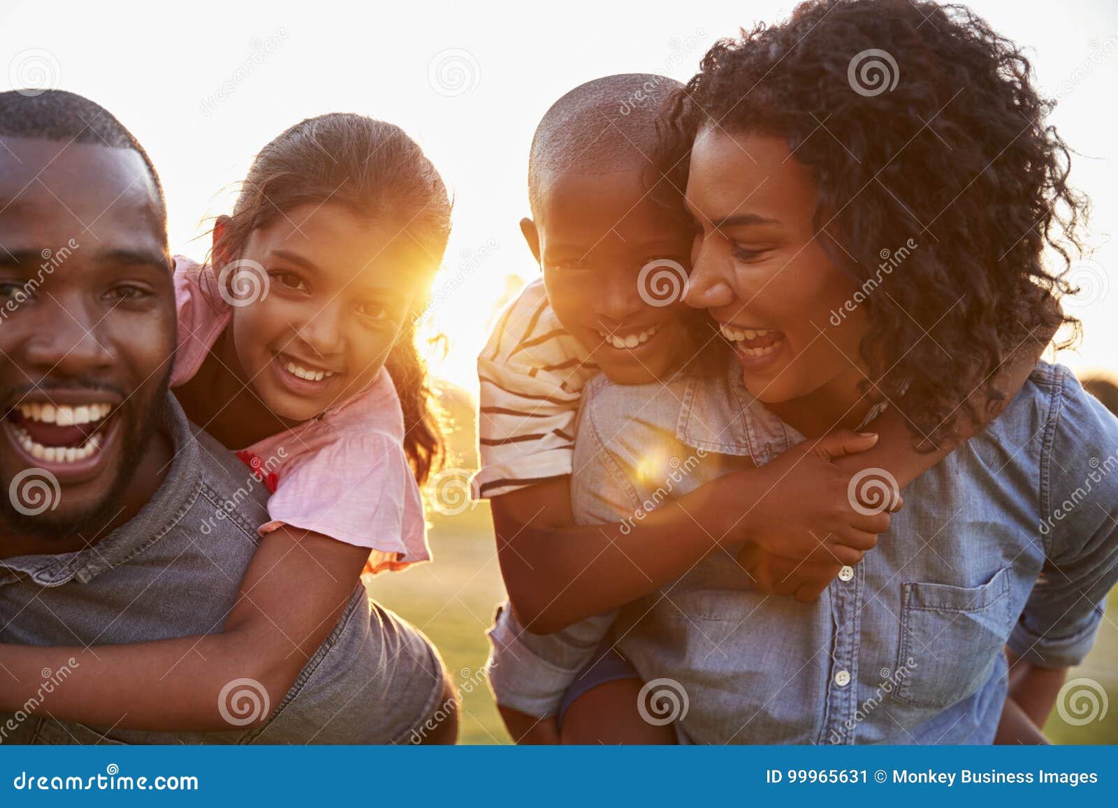 young black couple enjoying family time with children