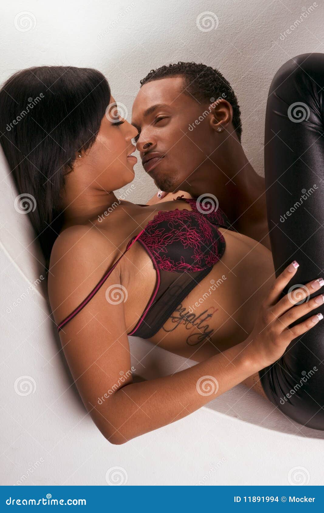Young Black Couple Man and Woman in Love Kissing Stock Photo