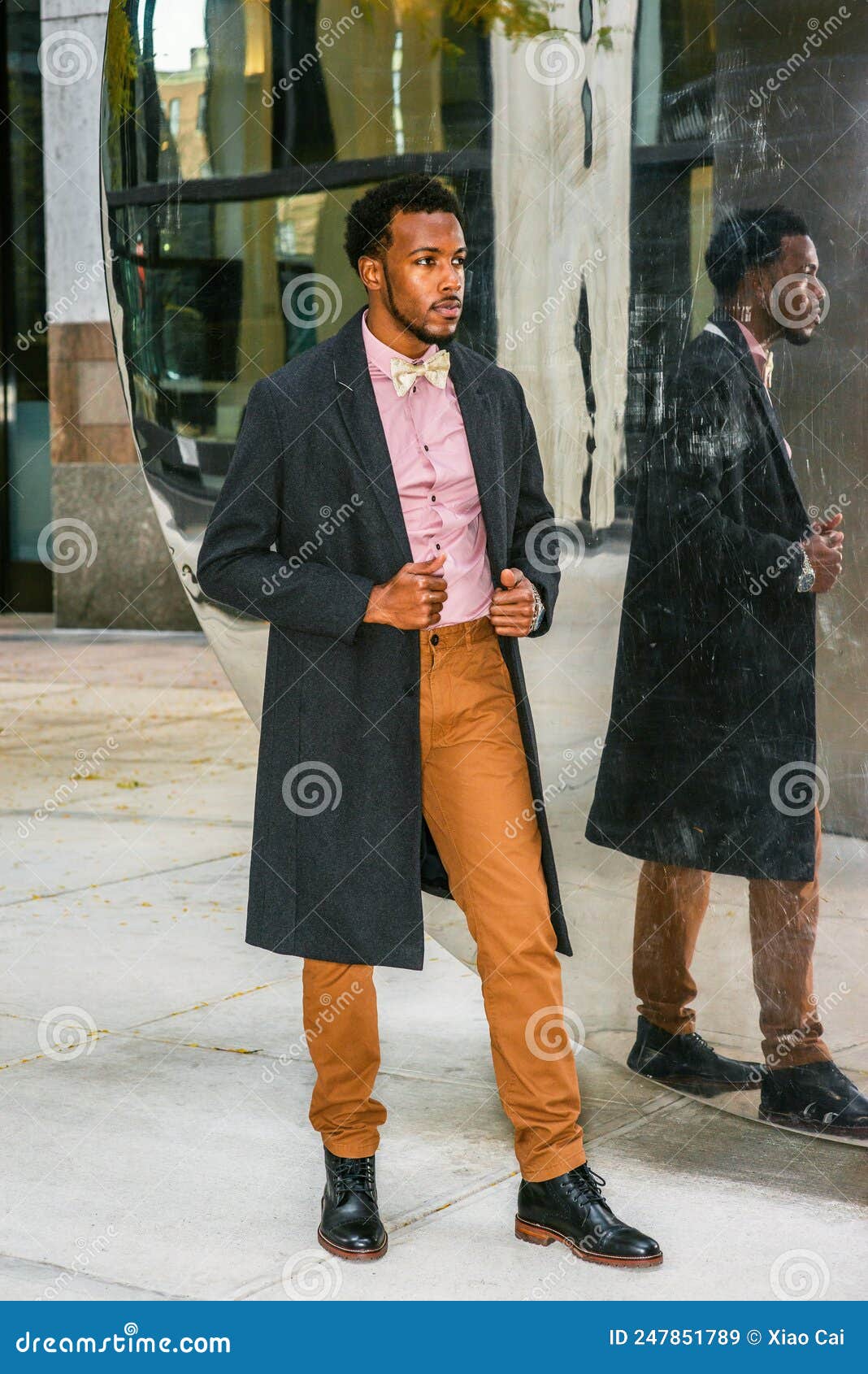 Young Black Man Standing by Mirror on Street in New York City Stock ...