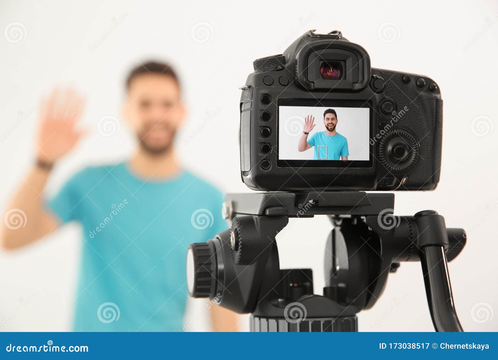 Young Blogger Shooting Video with Camera Against White, Focus on Screen Stock Image Image of