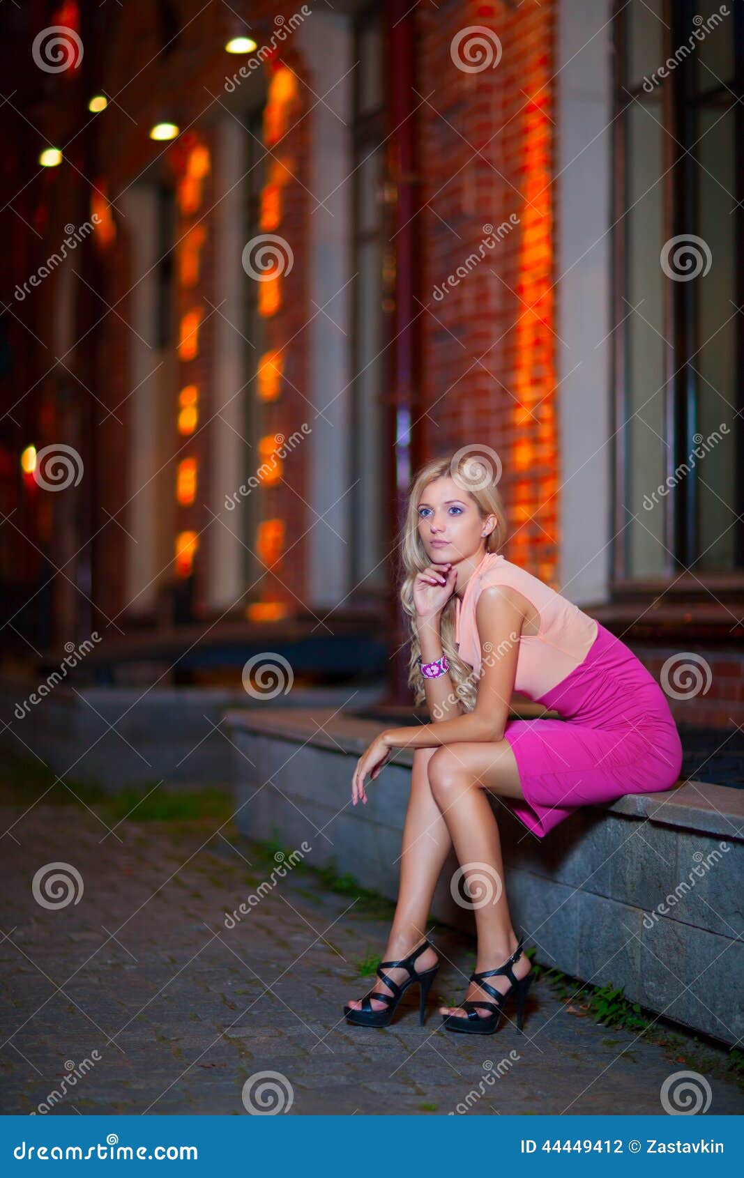 Young Blond Sits on Parapet Stock Photo - Image of hair, evening: 44449412