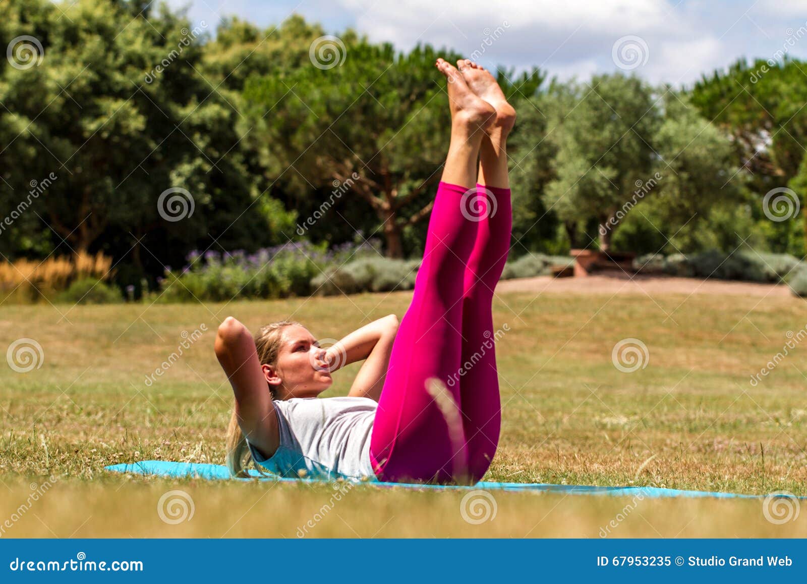 young blond woman exercising, toning up muscles