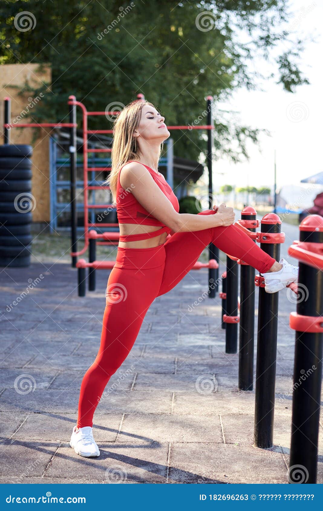 Young Blond Woman, Wearing Red Fitness Outfit Stretching on Sports  Playground in Summer Morning. Healthy Active Life Concept Stock Image -  Image of routine, health: 182696263