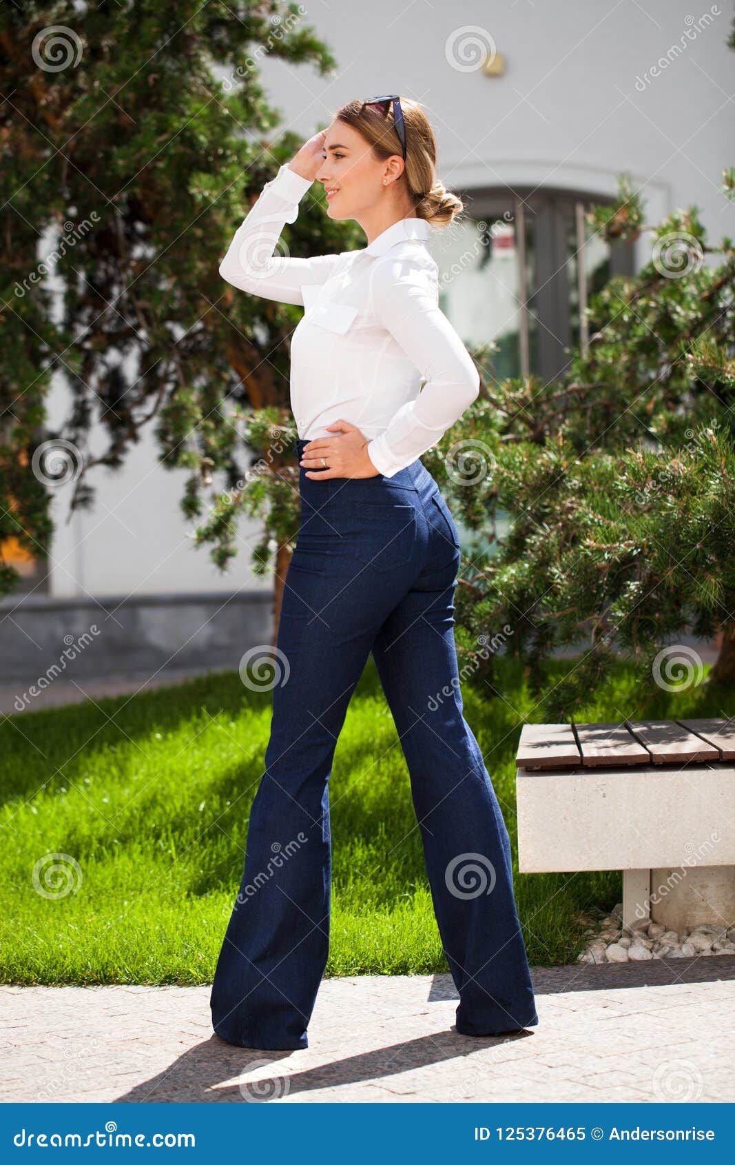 Young Blonde Business Woman in Blue Jeans and White Shirt Stock Image ...