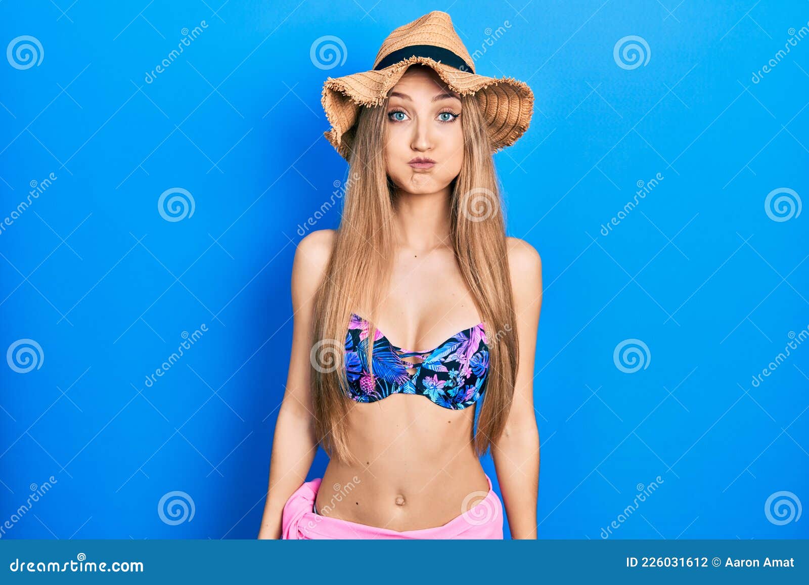 Young Blonde Girl Wearing Bikini and Puffing Cheeks with Funny Face Stock Photo - Image of crazy, full: 226031612