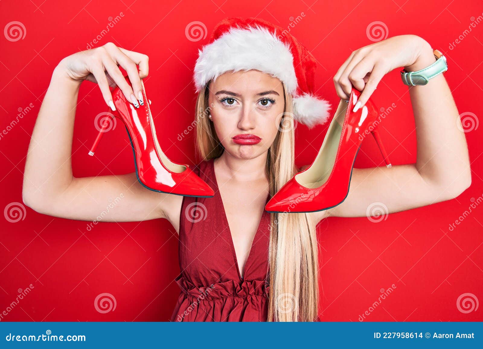 Young Blonde Girl Wearing Christmas Hat Holding High Heel Shoes ...