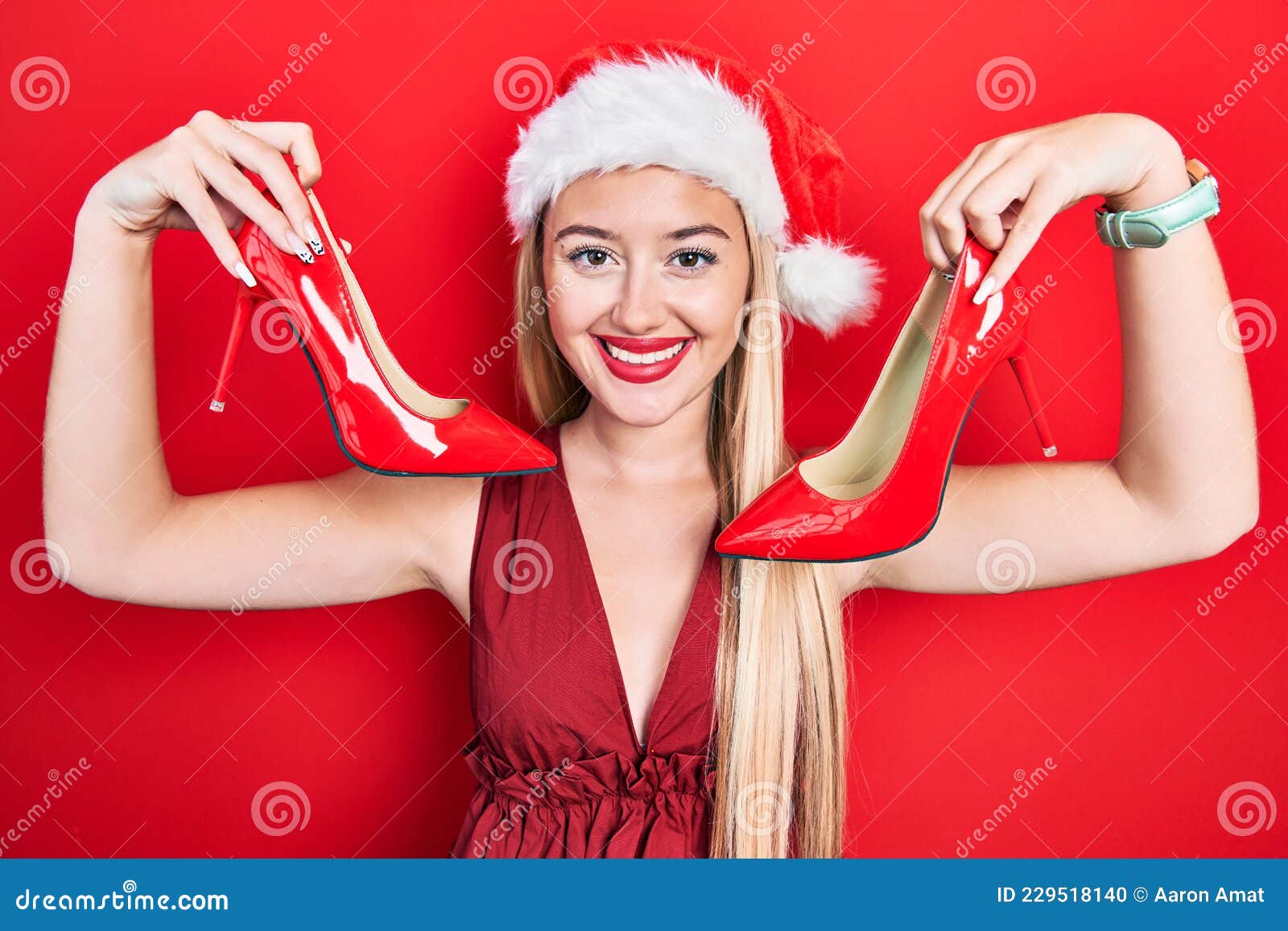 Young Blonde Girl Wearing Christmas Hat Holding High Heel Shoes Smiling ...
