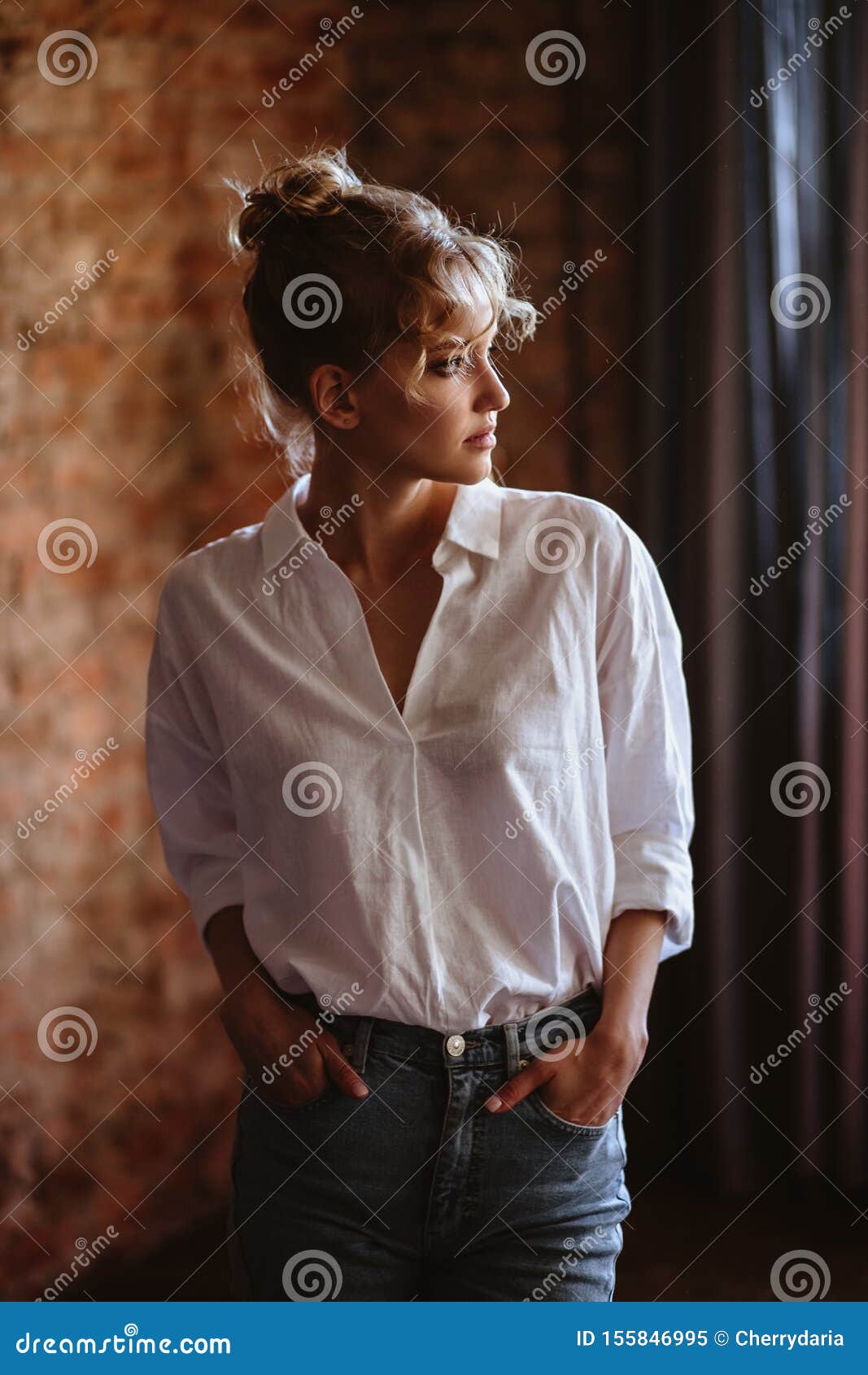 Young Blonde Woman in a Casual White Shirt and Jeans in a Loft Interior,  Close Up Fashion Portrait Stock Image - Image of girl, female: 155846995