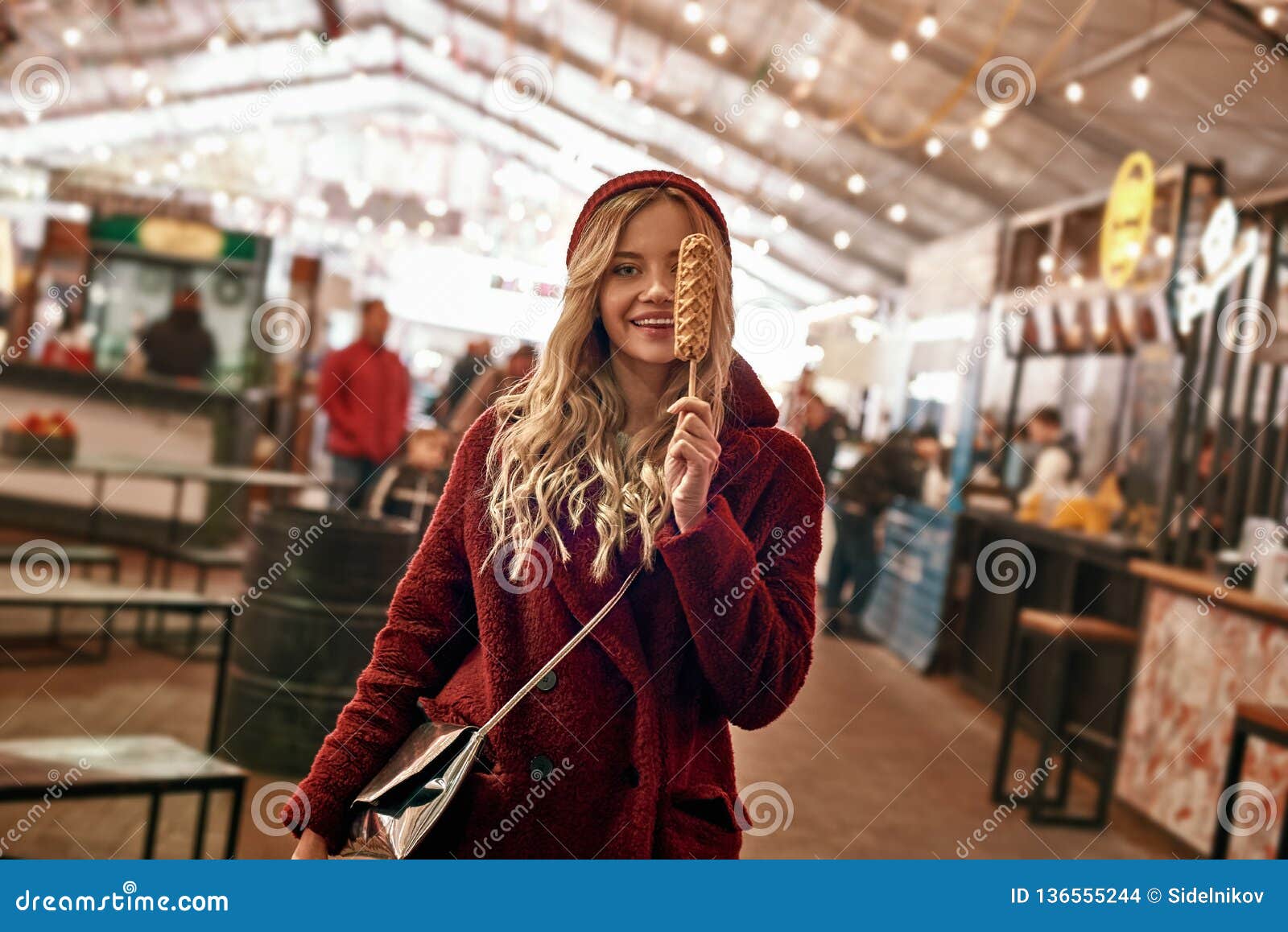 Young Blonde Woman Eatting Vegan Sausage in Dough Stock Photo - Image ...