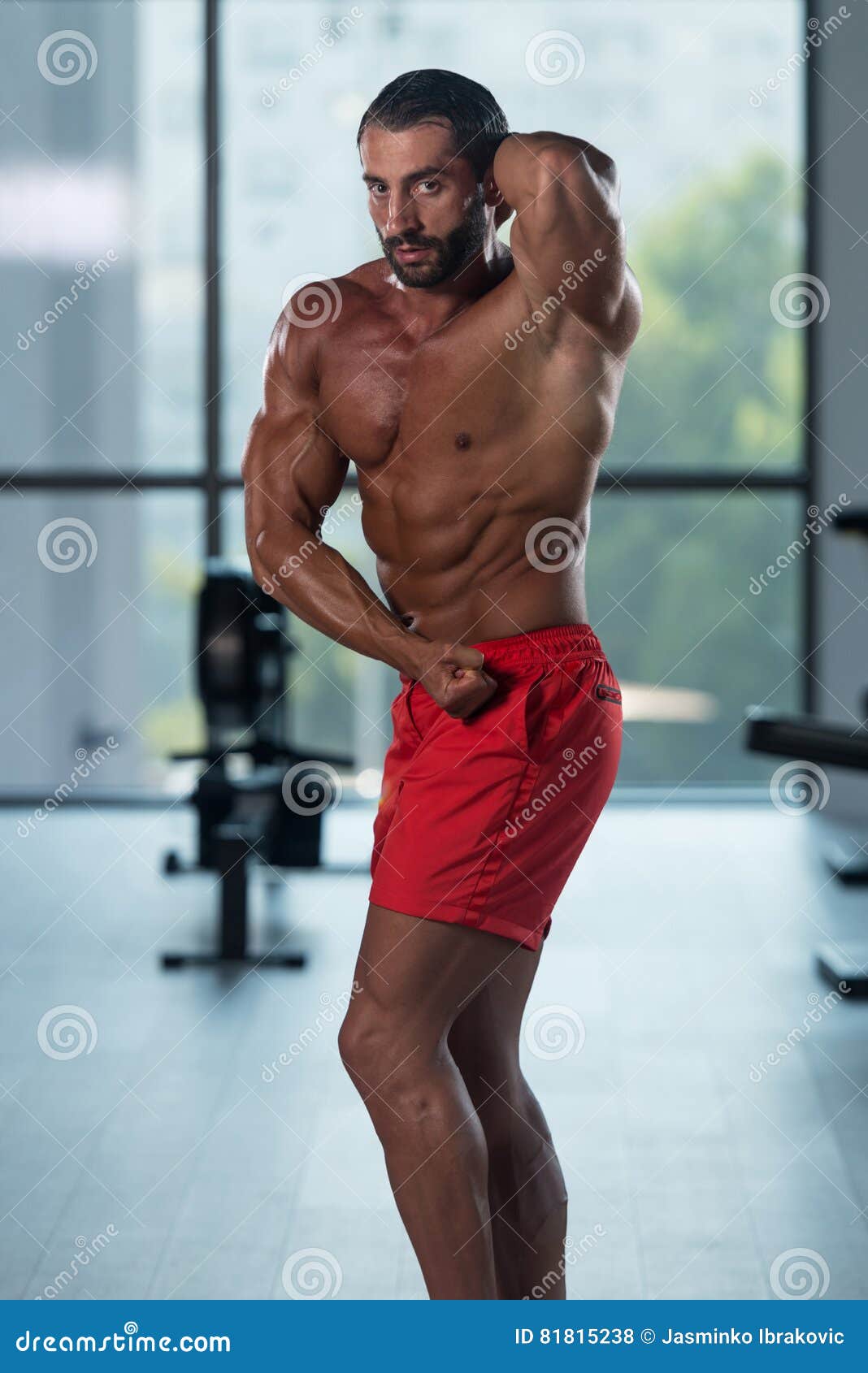 Young Bodybuilder Flexing Muscles Side Chest Pose Stock Photo - Image of  body, people: 81815238