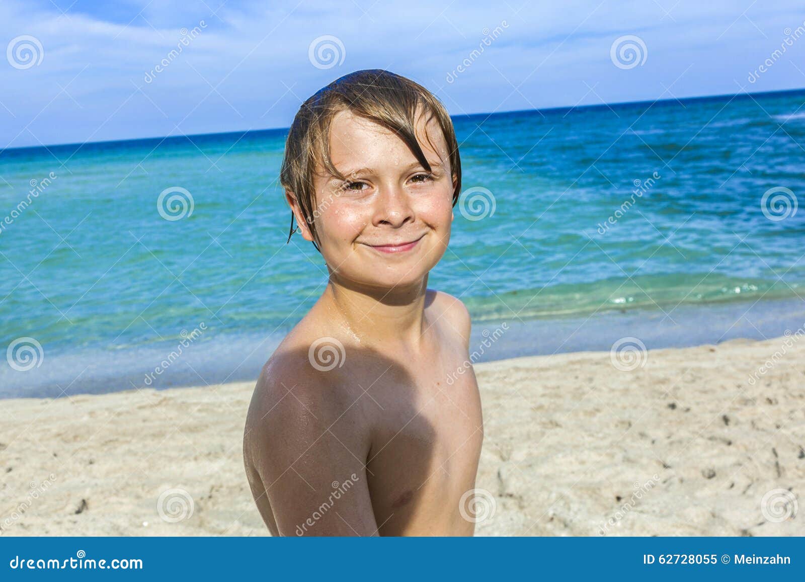 Young boy at the beach stock image. Image of outdoor - 62728055