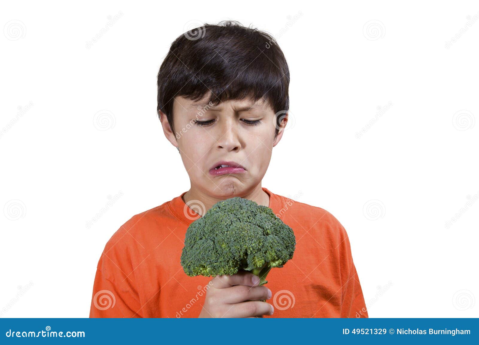 Young boy with broccoli stock image. Image of fresh, light 49521329