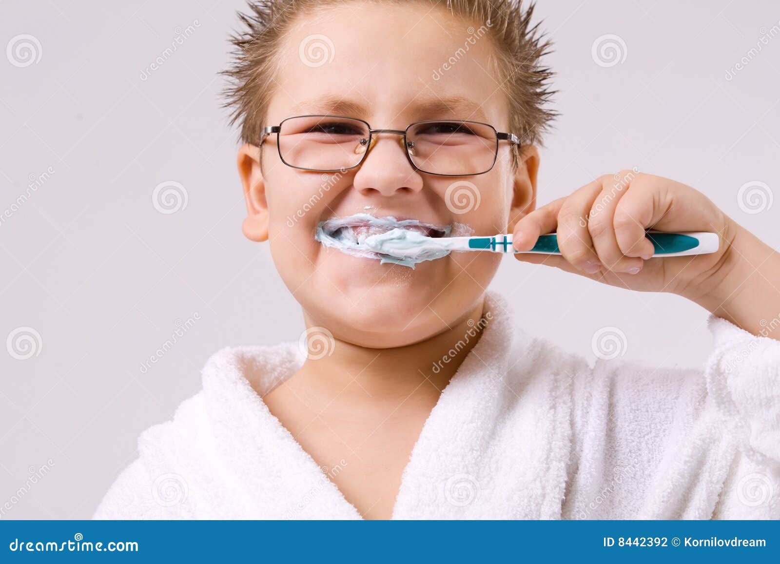 Young boy cleaning teeth stock photo. Image of clothing 8442392